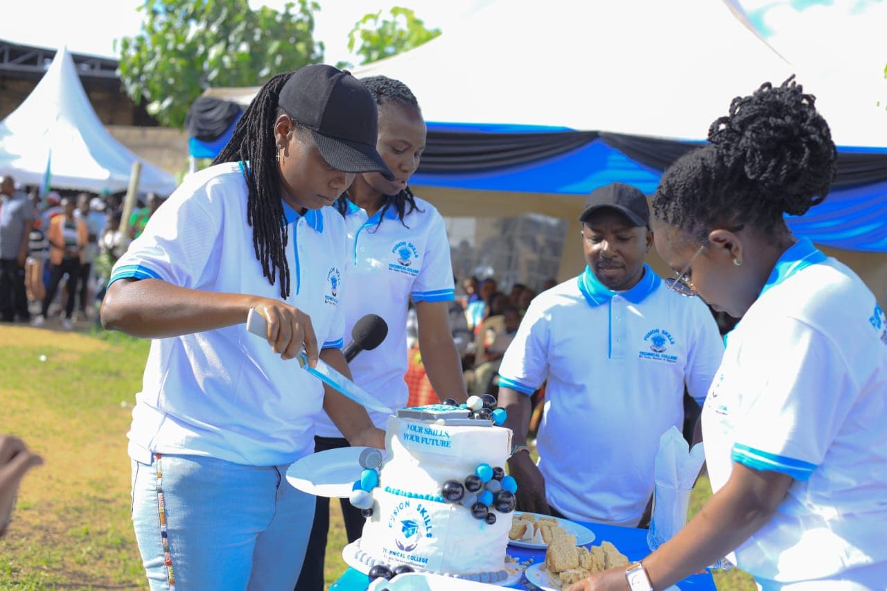 People cutting cake at Fusion Skills event